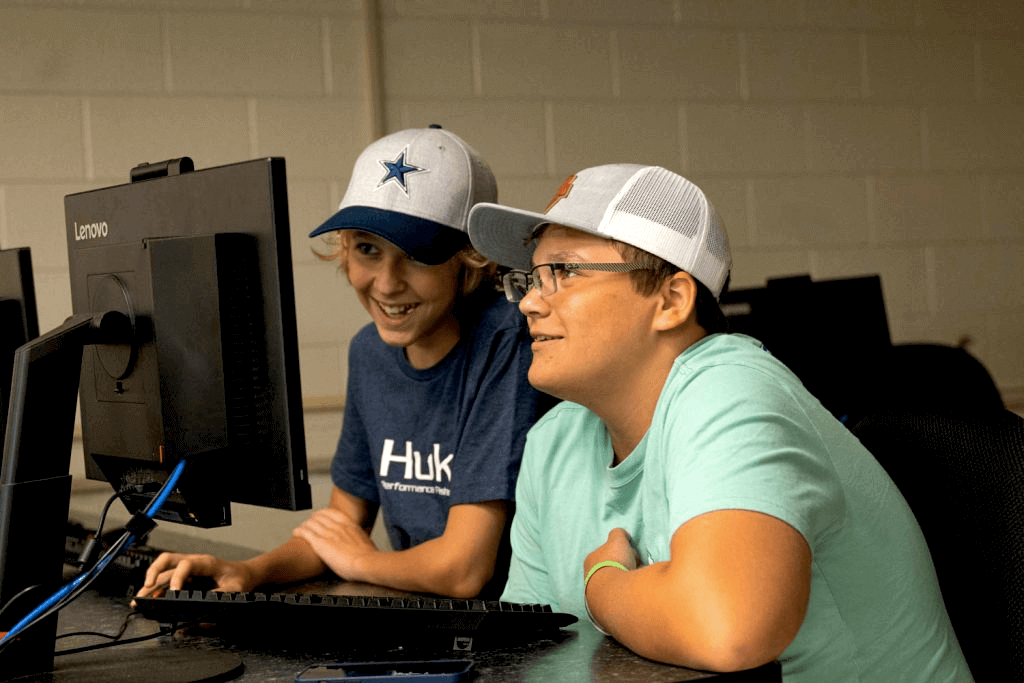 Kids studying on desktop computer