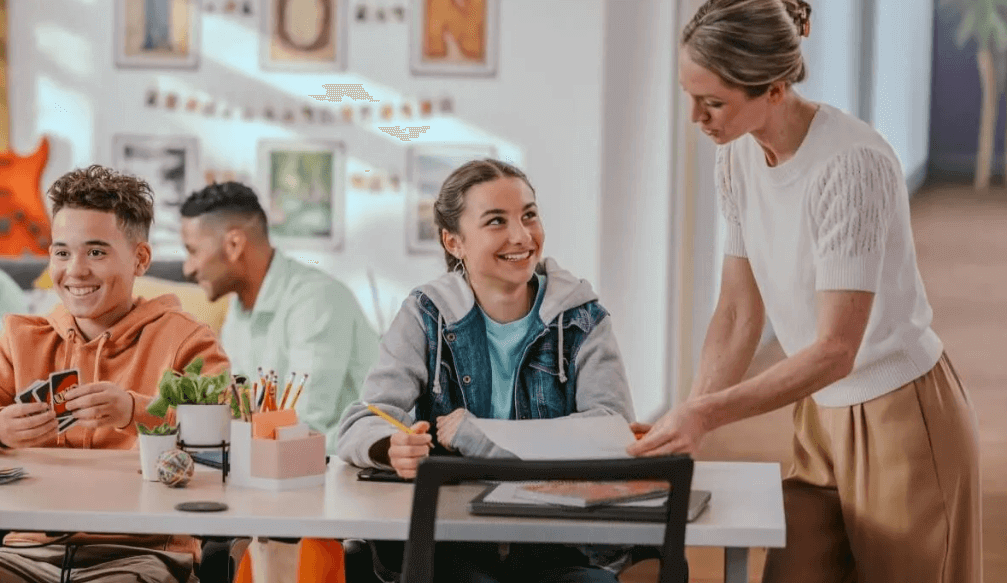 Student studying with teacher at the Homework Café