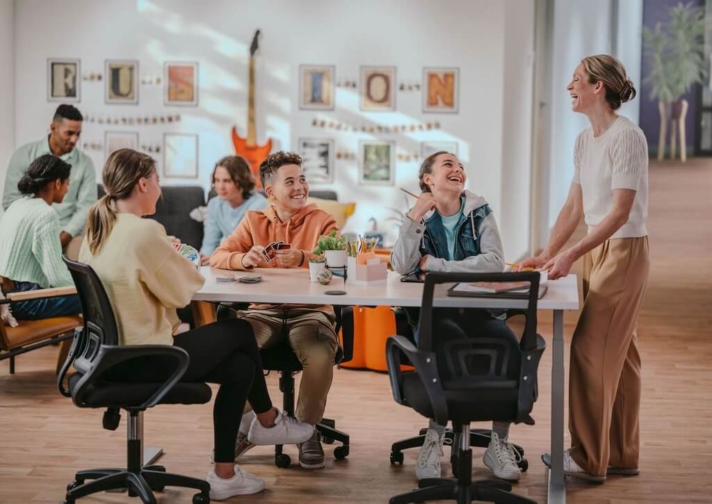 Fusion Academy students studying with their teacher in the Homework Café