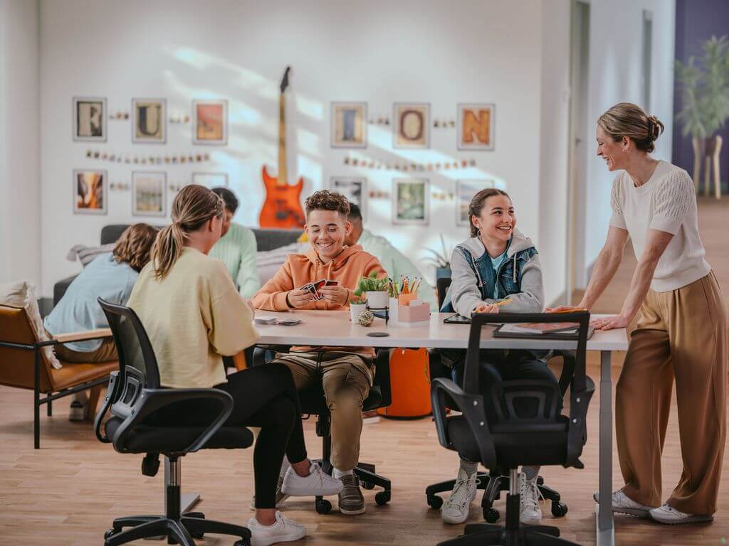 Fusion Academy students studying at the Homework Café with their teacher